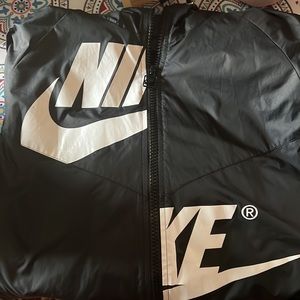 Women’s size L black and white split logo Nike windbreaker